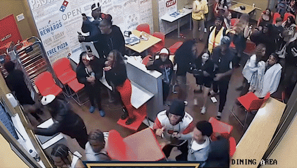 Fierce altercation breaks out at Domino’s; individuals throw chair, impact officer's cranium