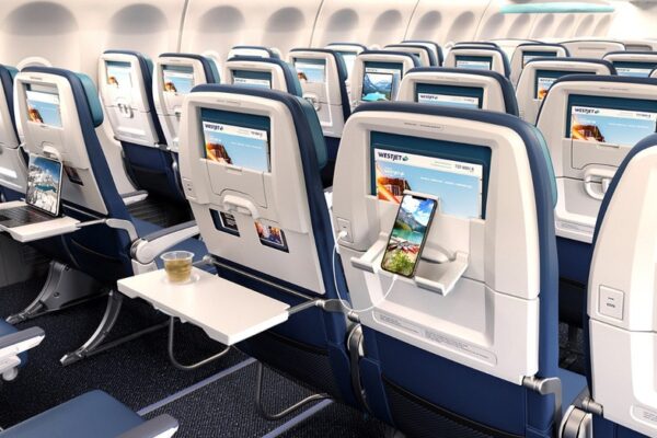 WestJet reverses cramped seating layout after viral videos show passengers' knees pressed against seats