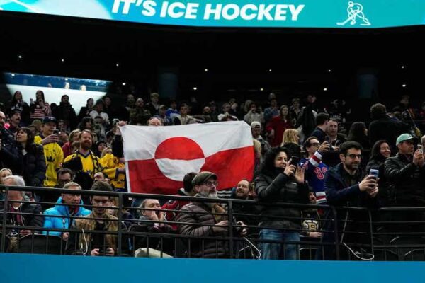 Olympic hockey fans raise Greenland's flag during USA's dominant win over Denmark, sparking viral reaction